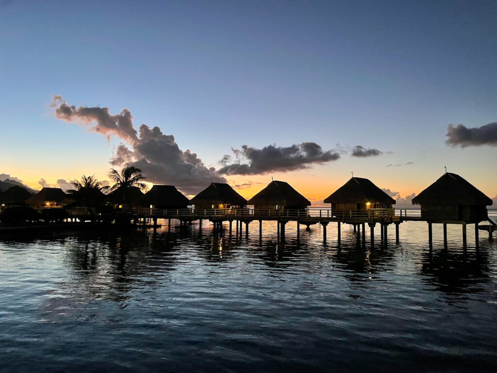 sunset and overwater bungalows in Moorea
