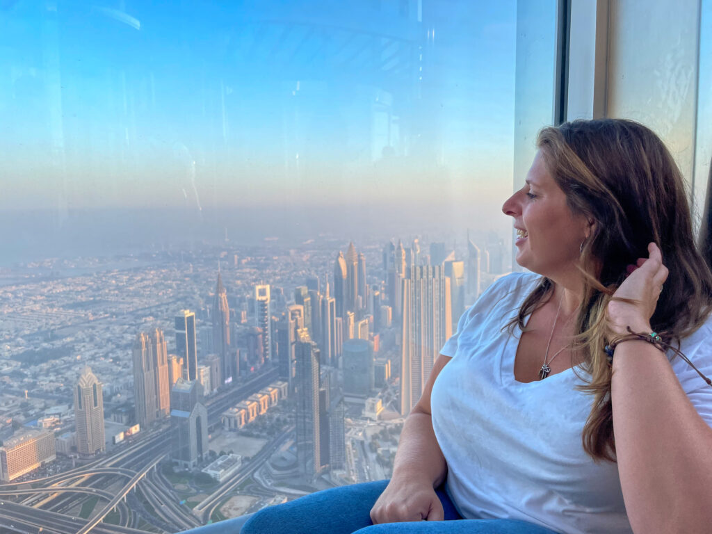 Hannah Logan looking out the window at the Burj Khalifa in Dubai
