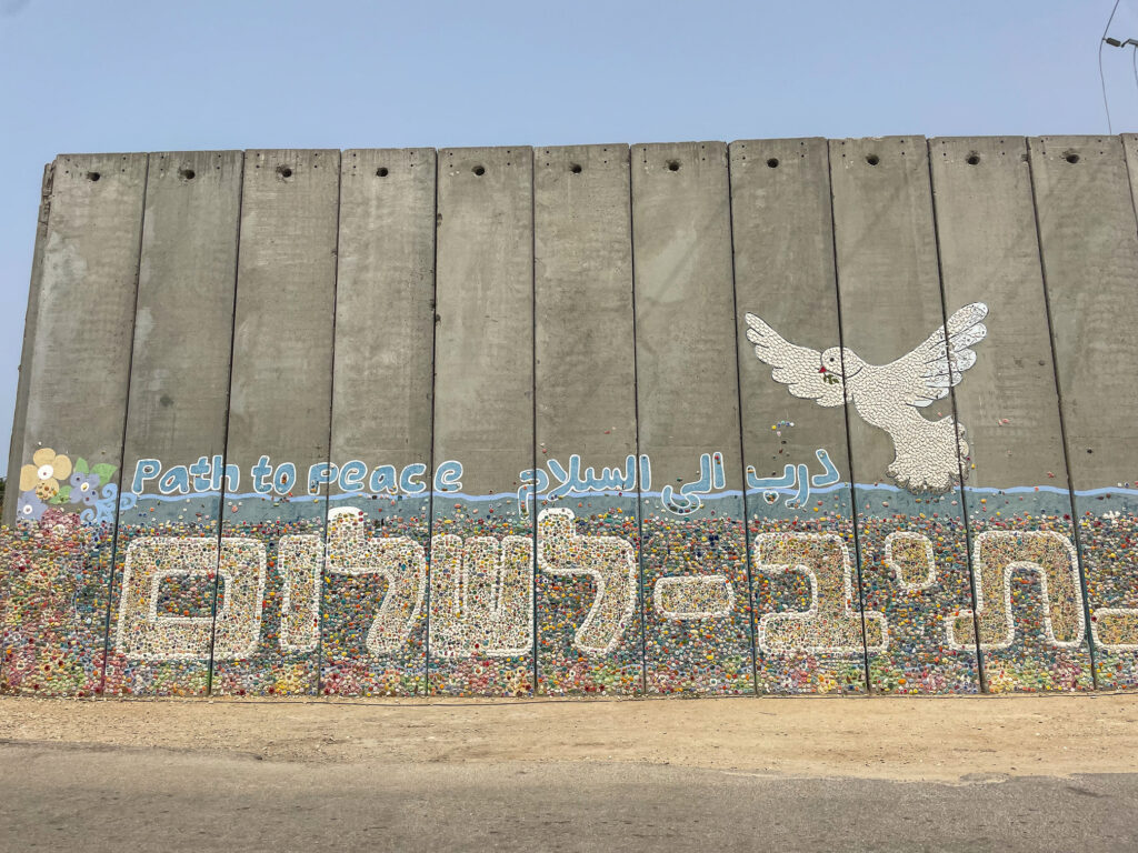 Mural on wall with dove and Path to Peace written