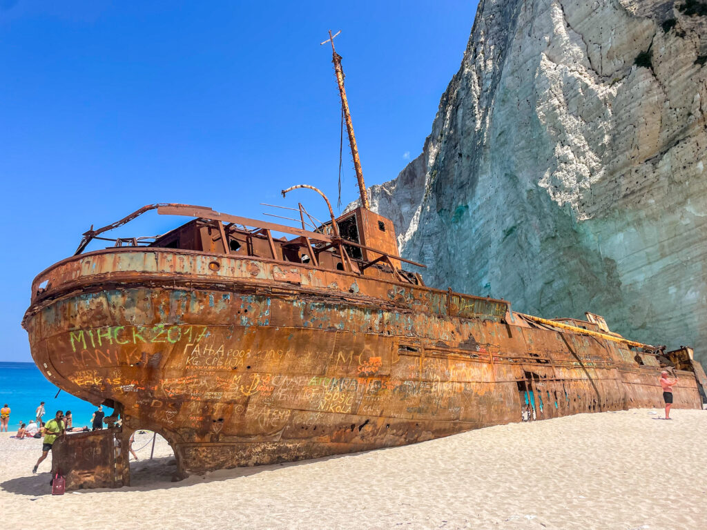 rusted shipwreck on Navagio beach in Zakynthos Greece