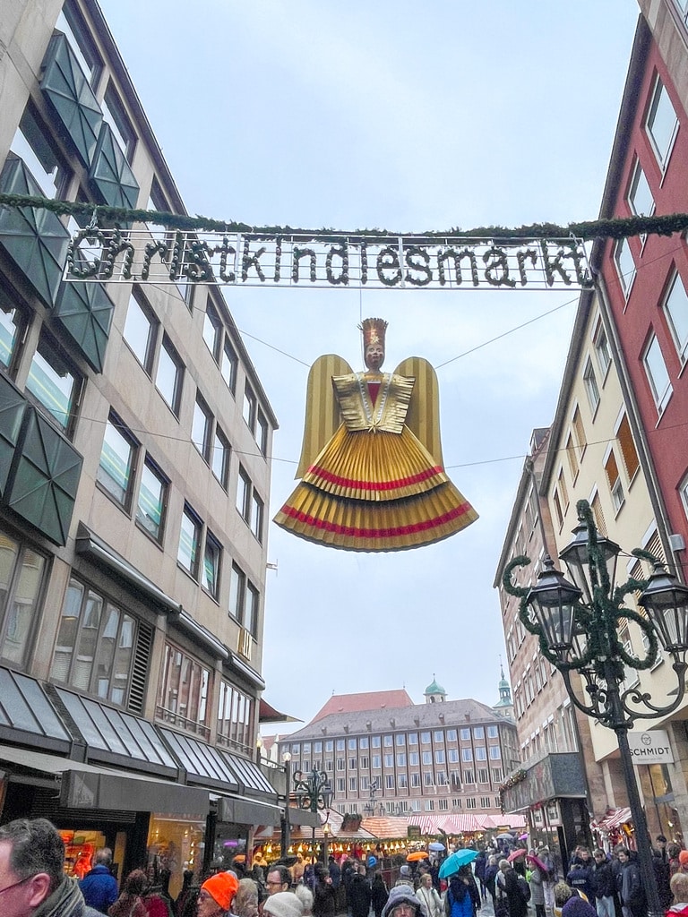 Christkind decoration (an angle in a golden dress) hanging in the street of Nuremberg 