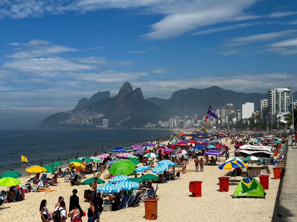 beach umbrellas lining the sandy beach of Ipanema, Rio de Janeiro