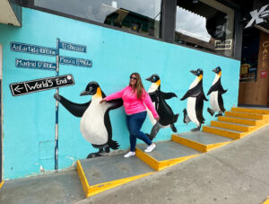 Hannah posing with penguin streetart