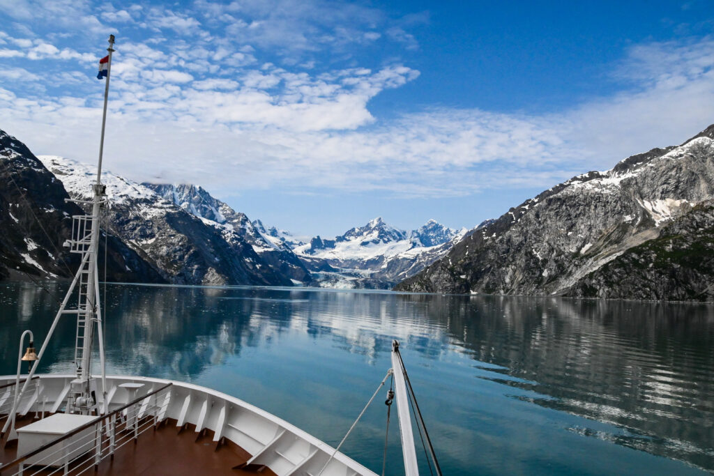 View from the deck of the cruise ship into Glacier bay and a distant mountain range