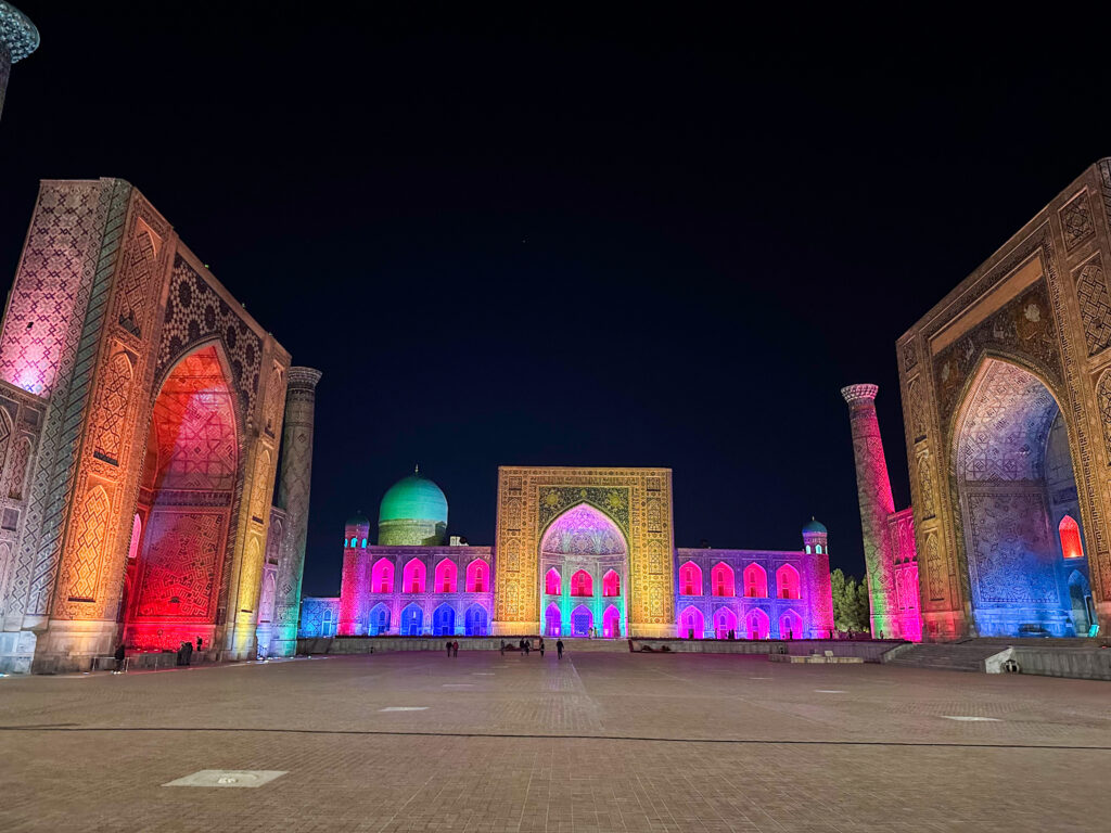 Registan square light show, all the buildings get lit up with bright colours.